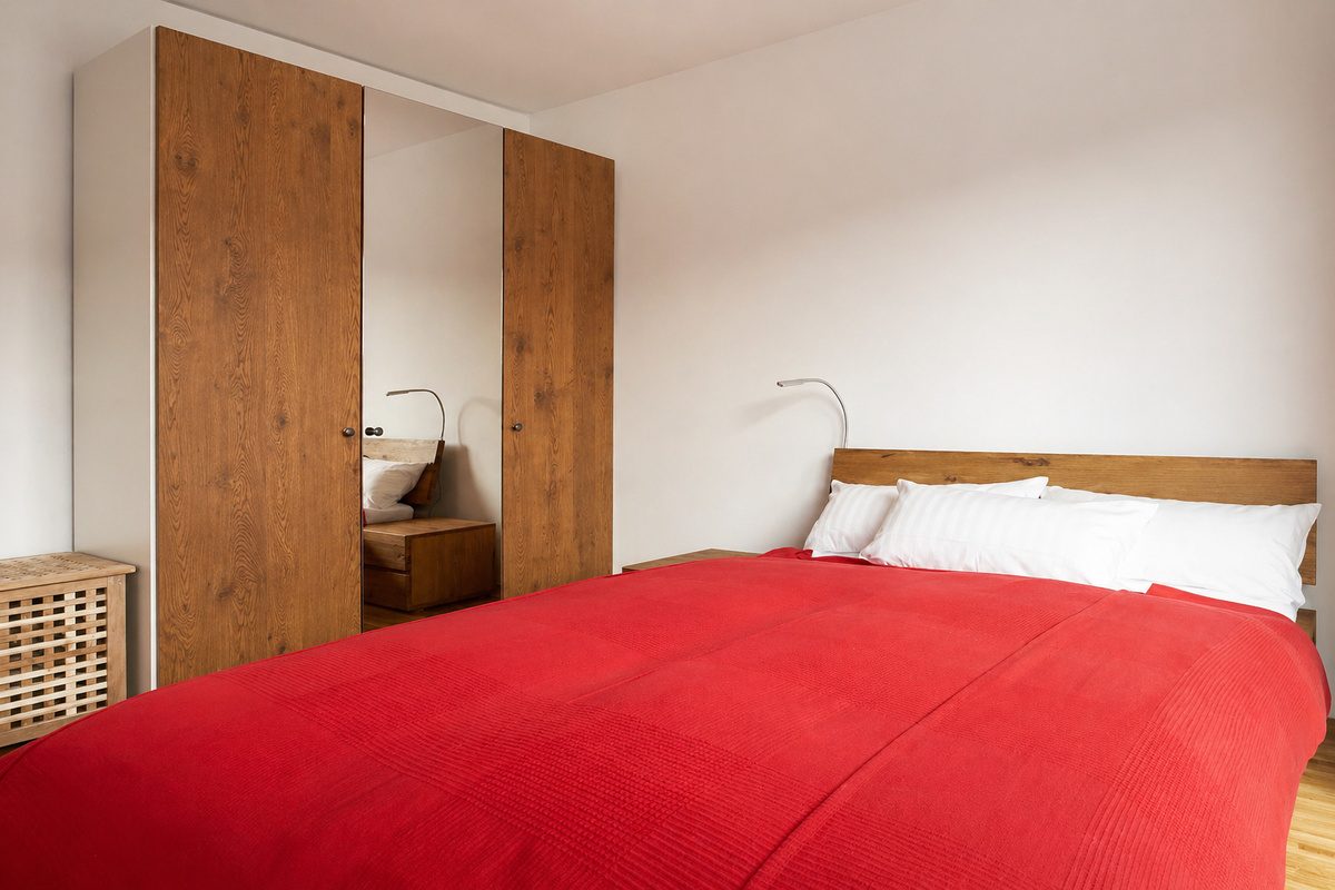 Queen-size bed and large wardrobe in bedroom