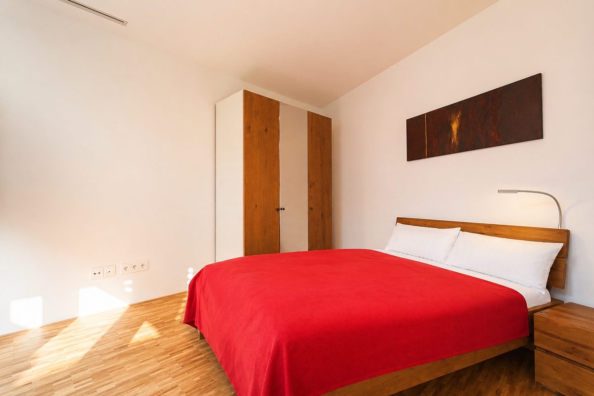 Second bedroom with queen-size bed, nightstand and wardrobe