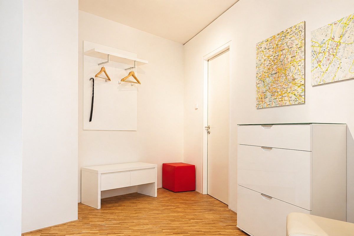 Entry hallway with dresser and coat rack