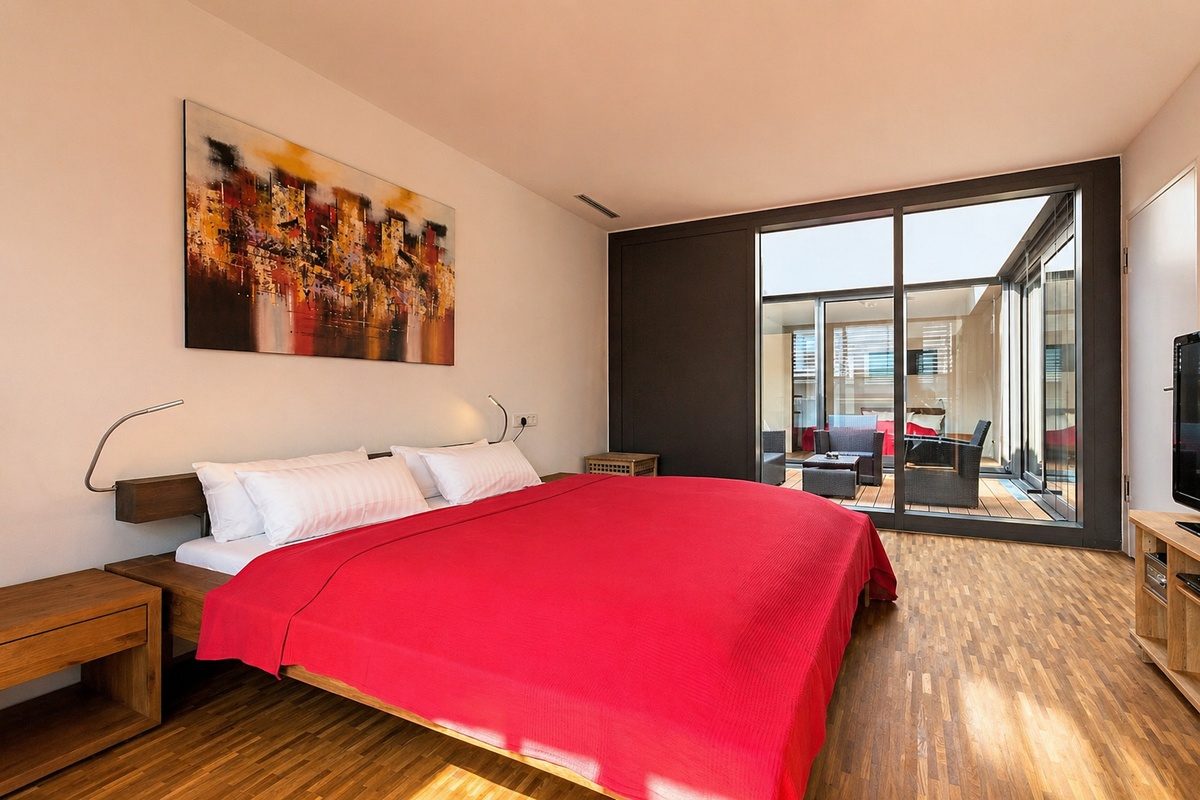 serviced apartment with king-size bed in master bedroom