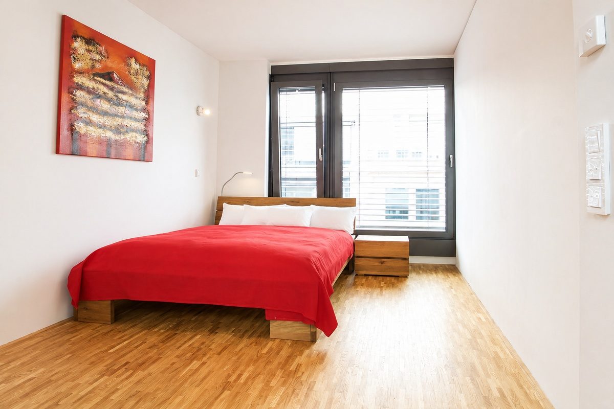 Second bedroom with queen-size bed and large window