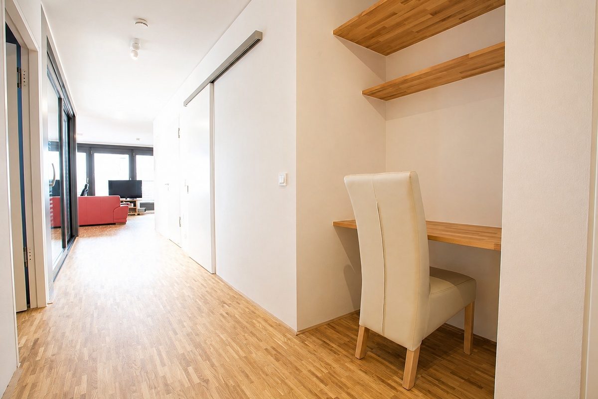 Furnished apartment hallway with desk