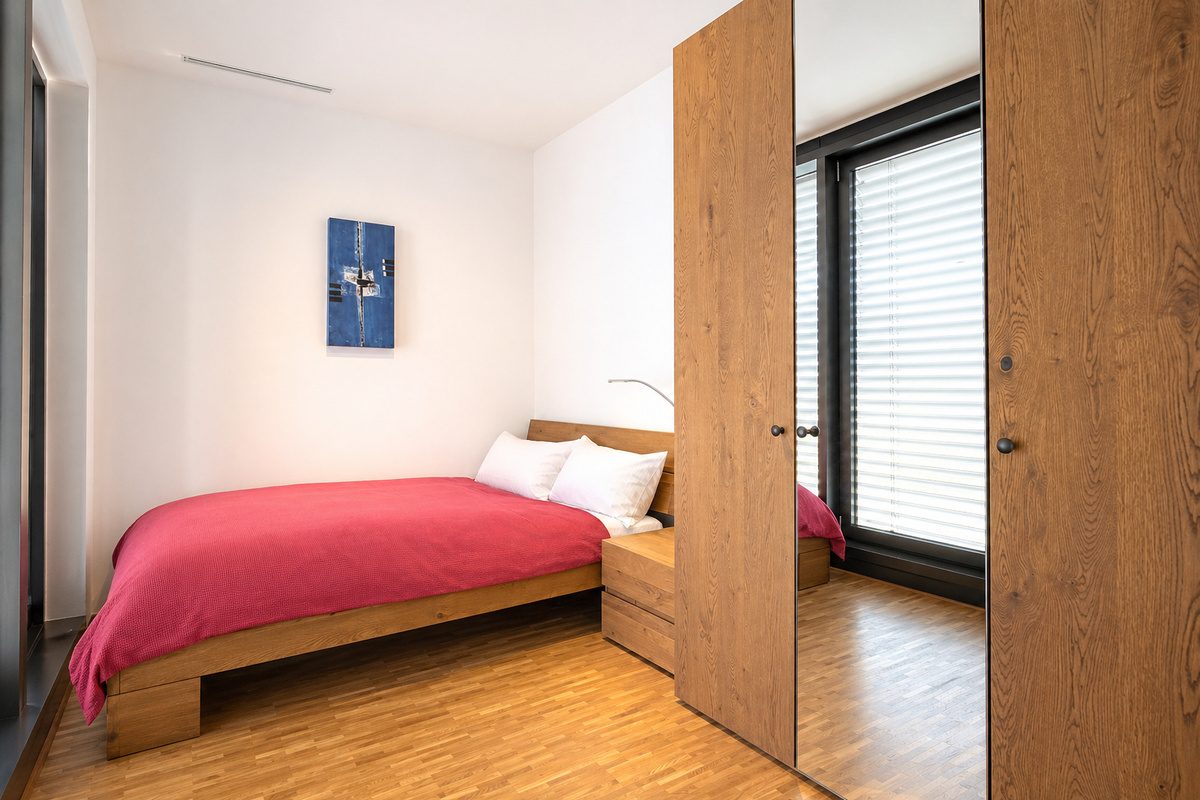 Queen-size bed and wardrobe in second bedroom