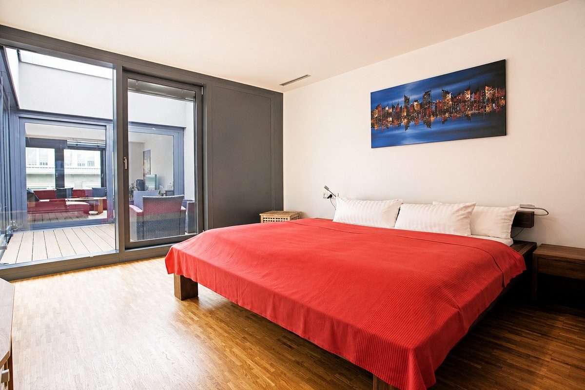King bed and patio access in bedroom