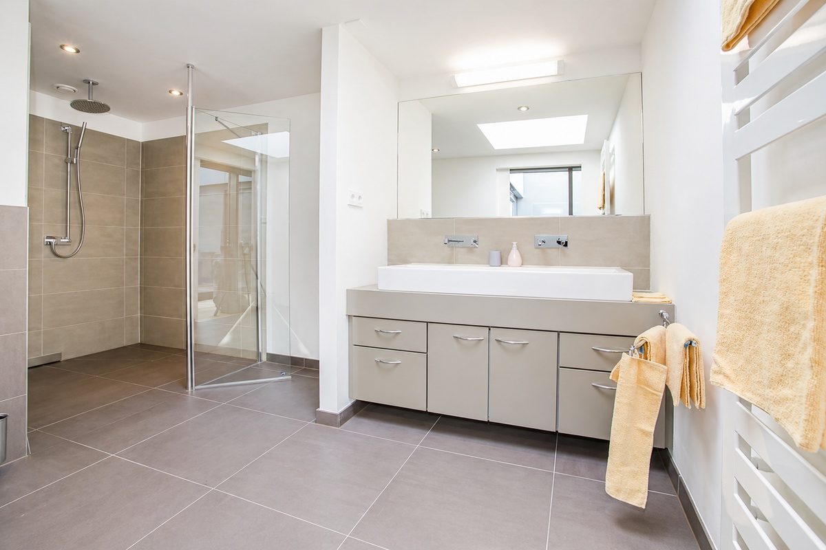 Bathroom with shower and large sink