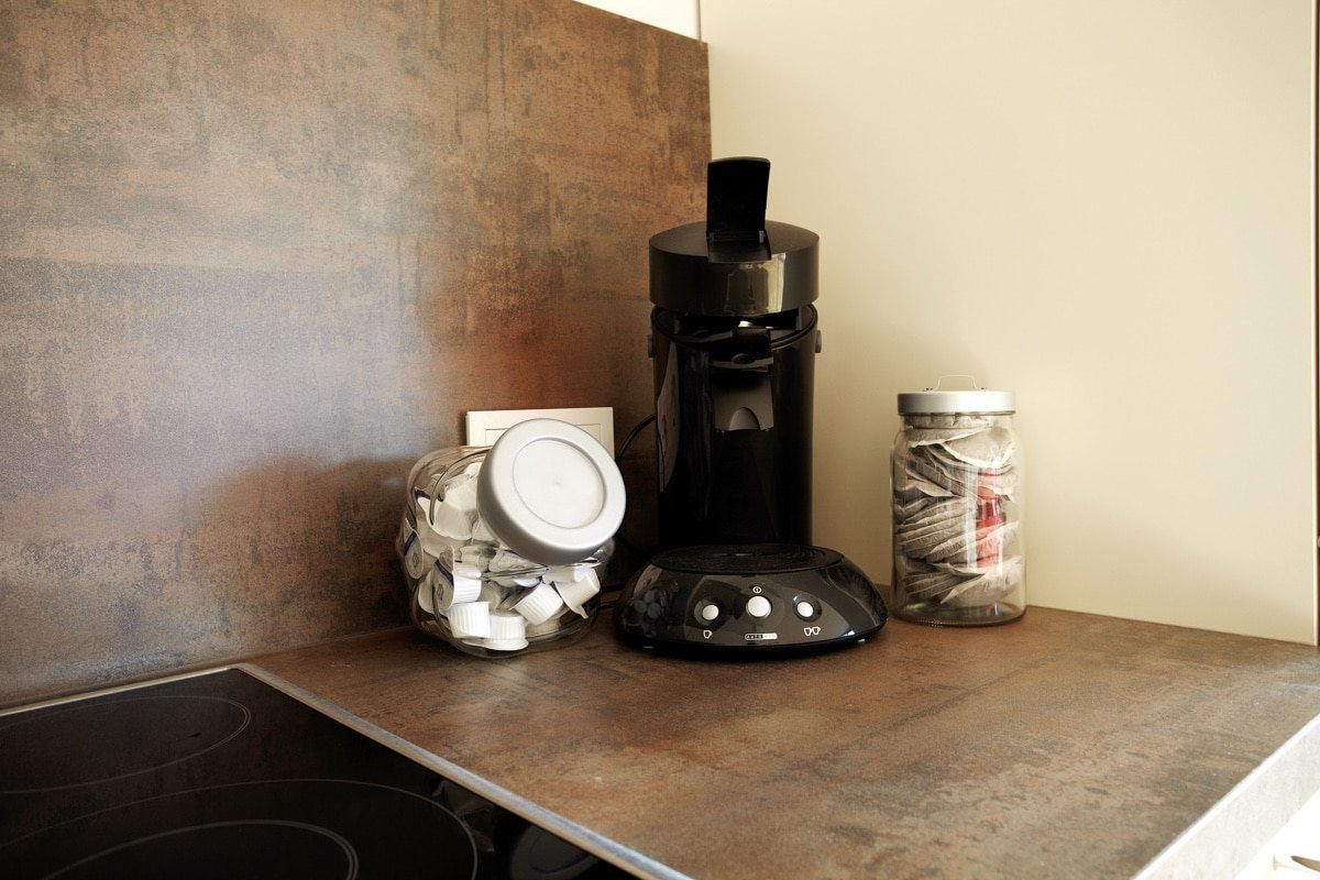 Cooktop and coffee maker in kitchen