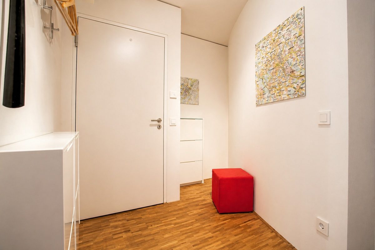 Entry hallway with maps, coat rack and shoe cabinet