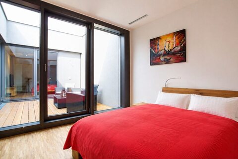 Second bedroom with queen bed and patio access