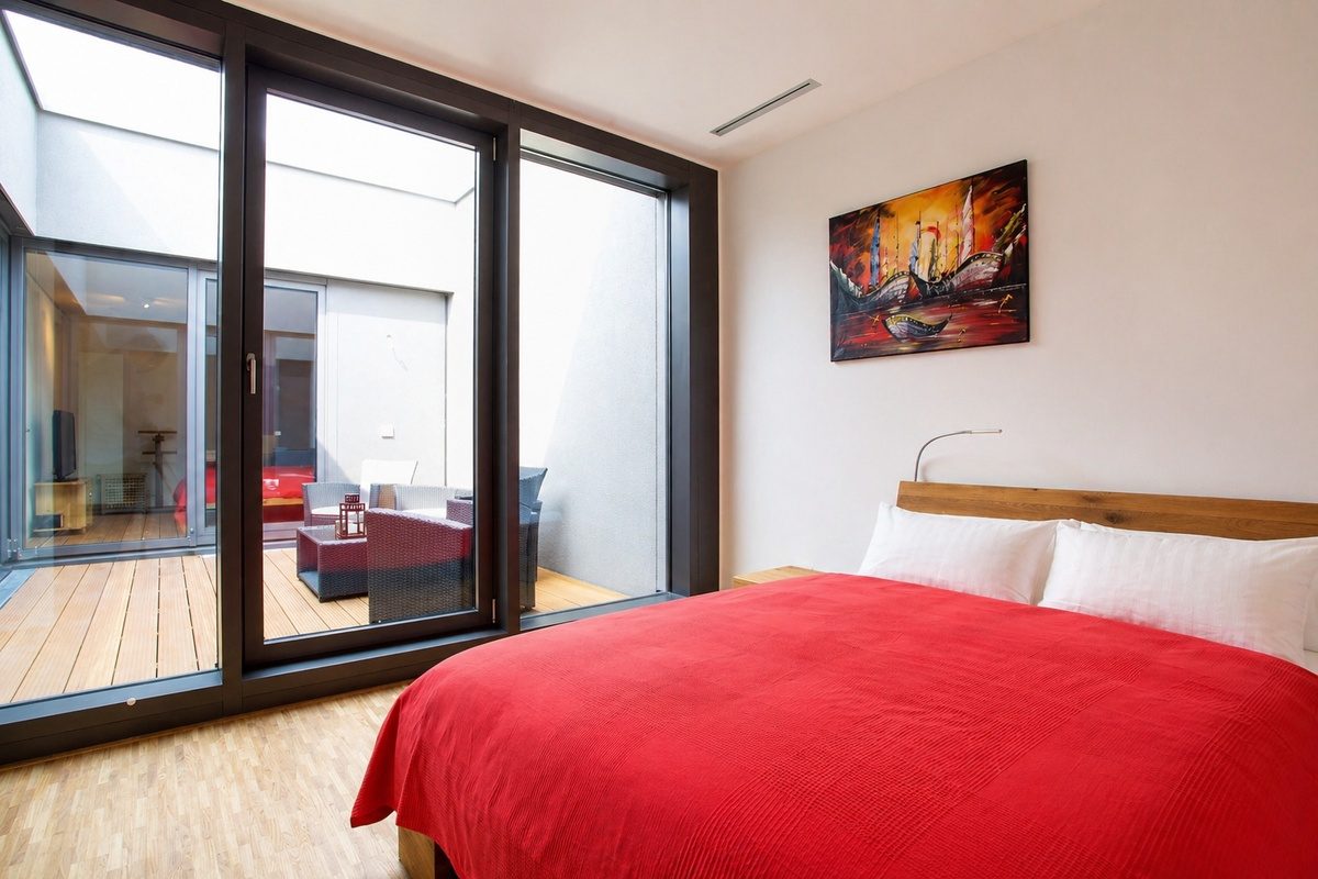 Second bedroom with queen bed and patio access