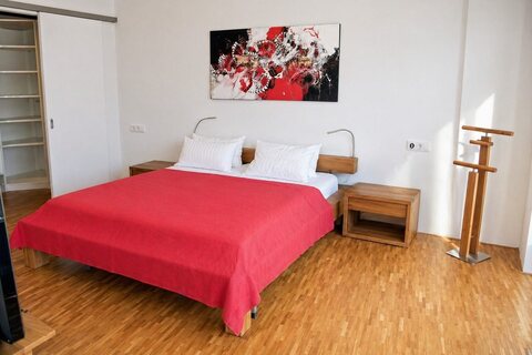 Master bedroom with king-size bed and walk-in closet