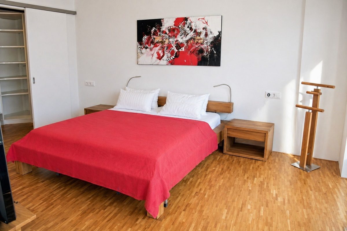 Master bedroom with king-size bed and walk-in closet