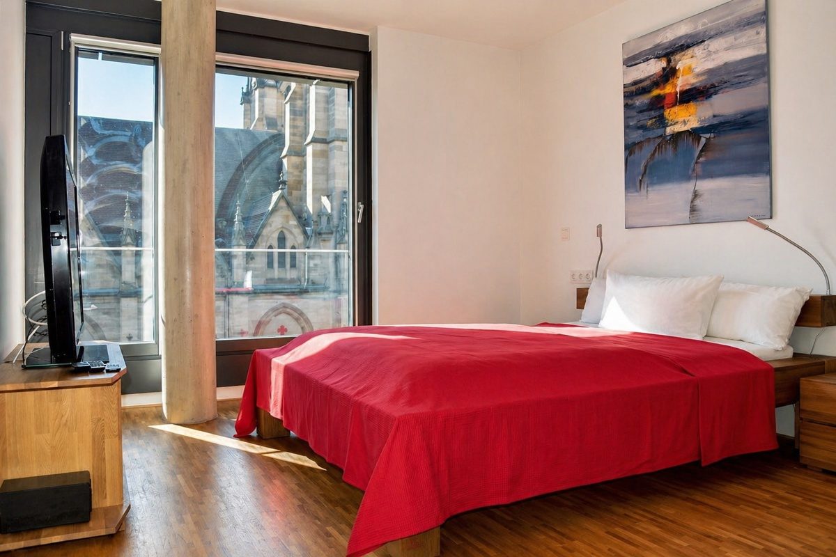 Queen-size bed and TV in second bedroom