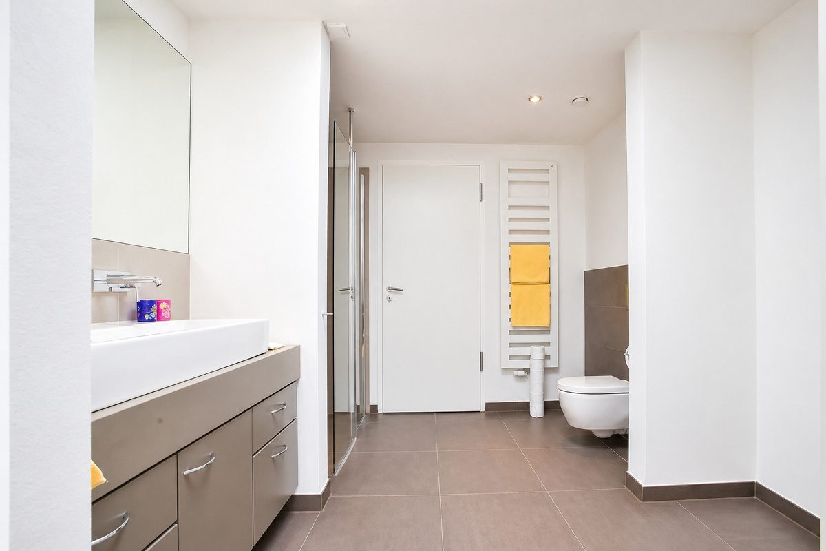 Large bathroom with shower, sink and toilet