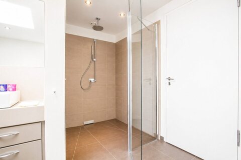 Bathroom with large glass shower