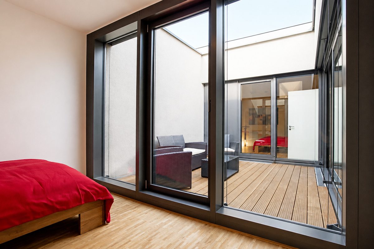 Queen-size bedroom with patio access