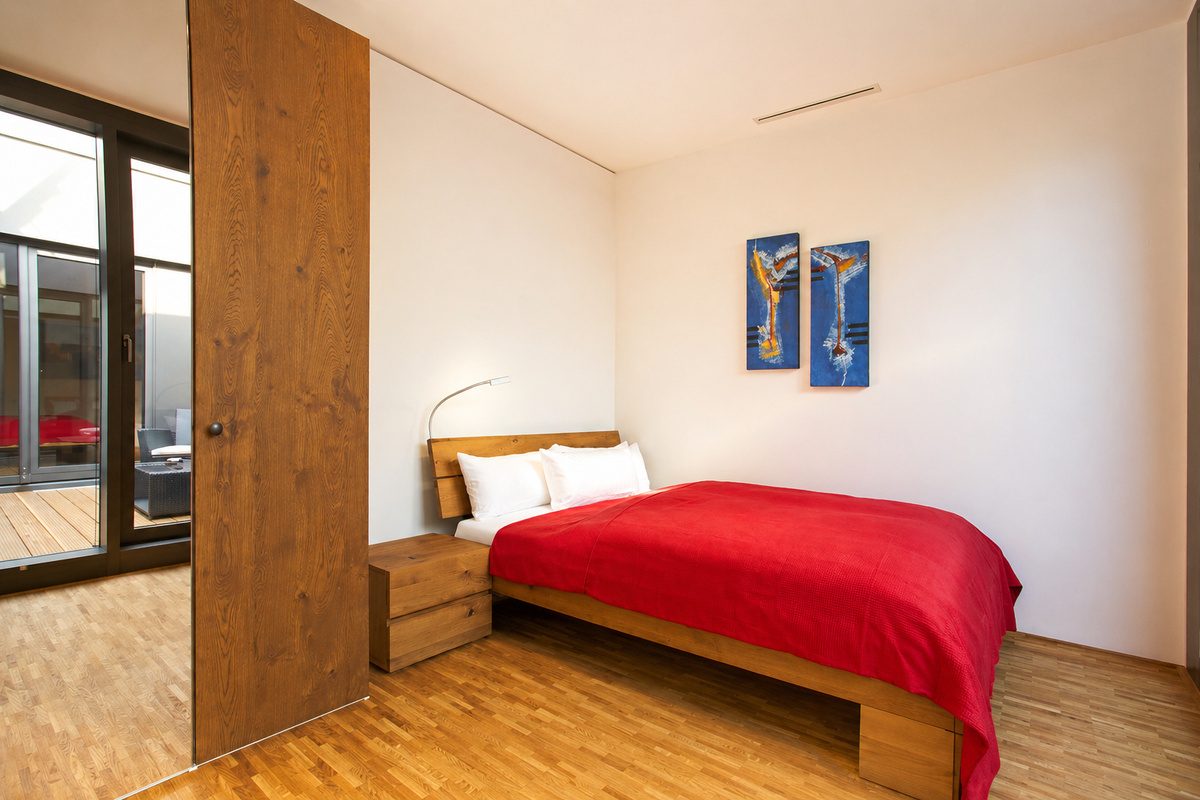 Second bedroom with queen bed and wardrobe