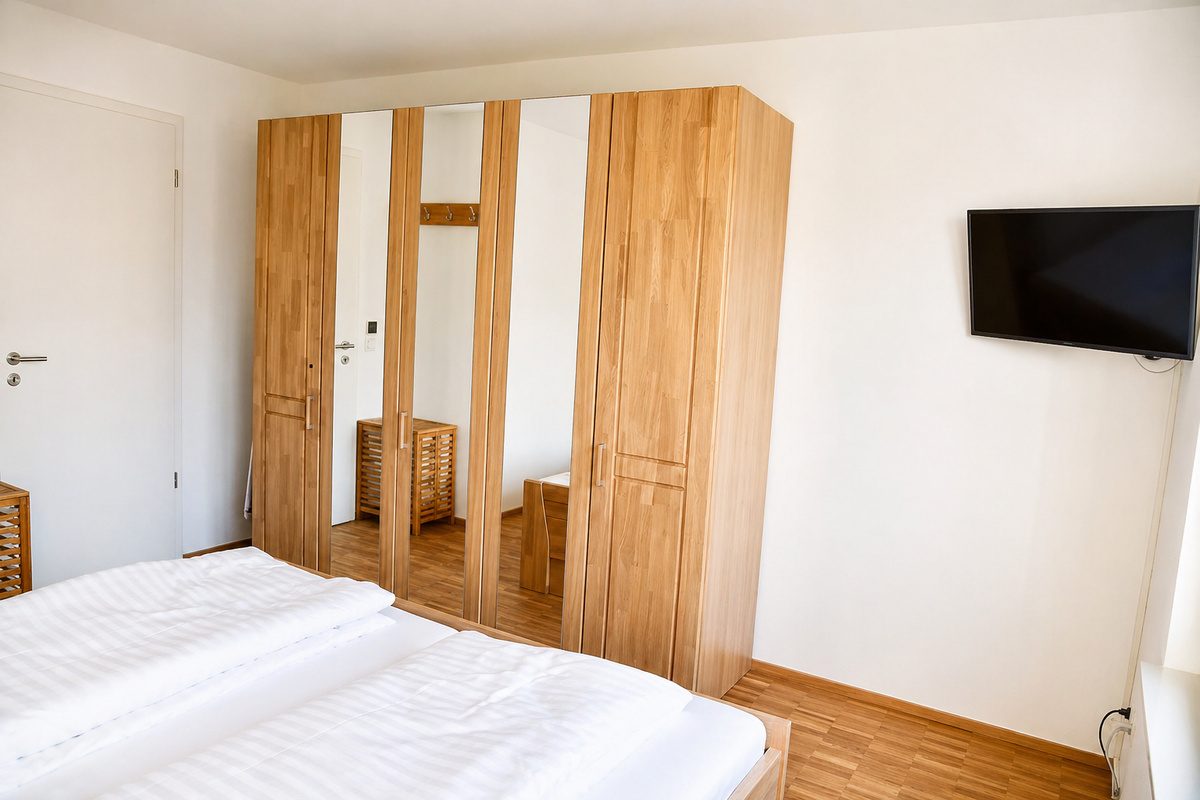 Bedroom with wardrobe and TV