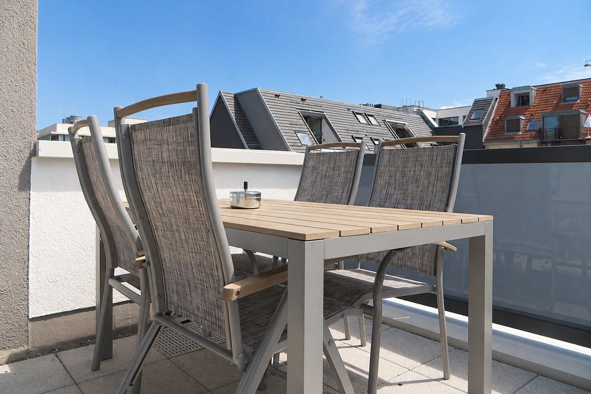 Balcony with table and chairs