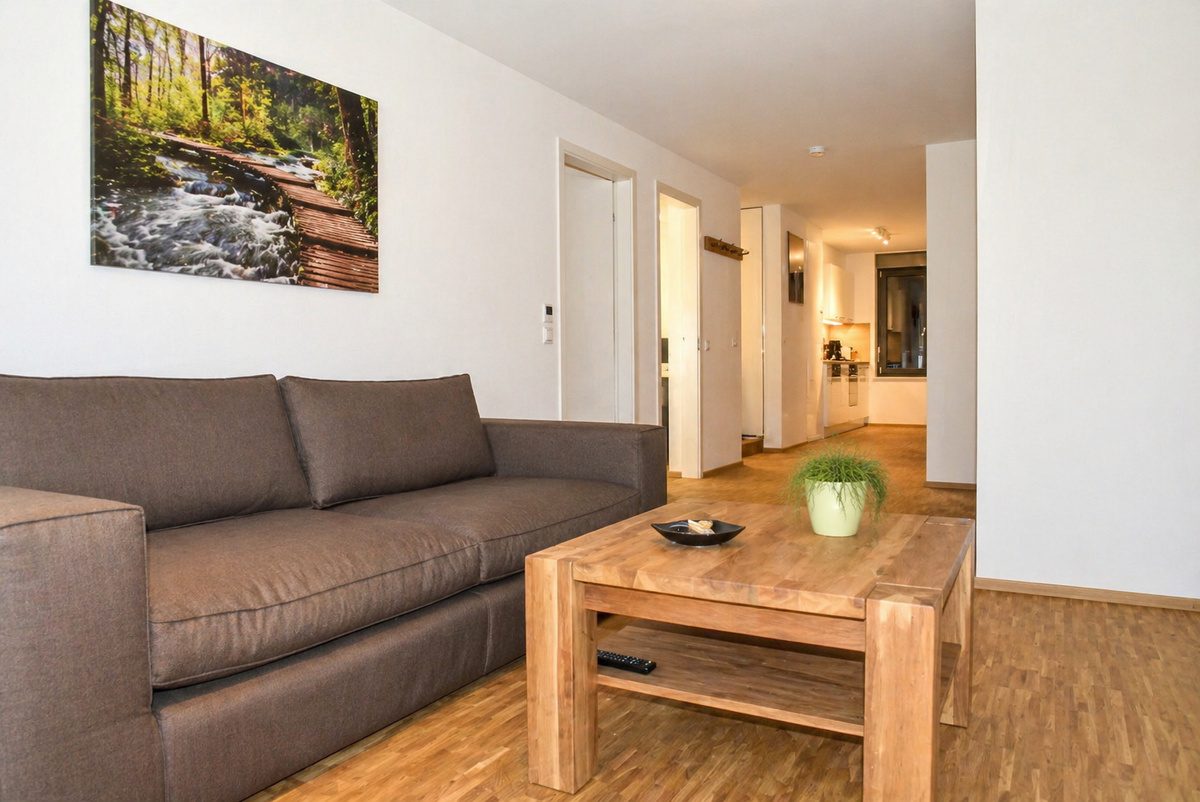 Living area with couch in short-term apartment