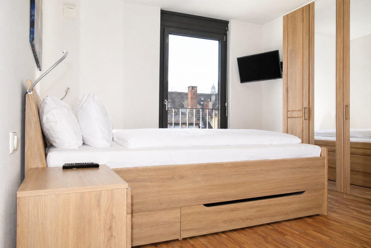Main bedroom with king bed, wardrobe and TV