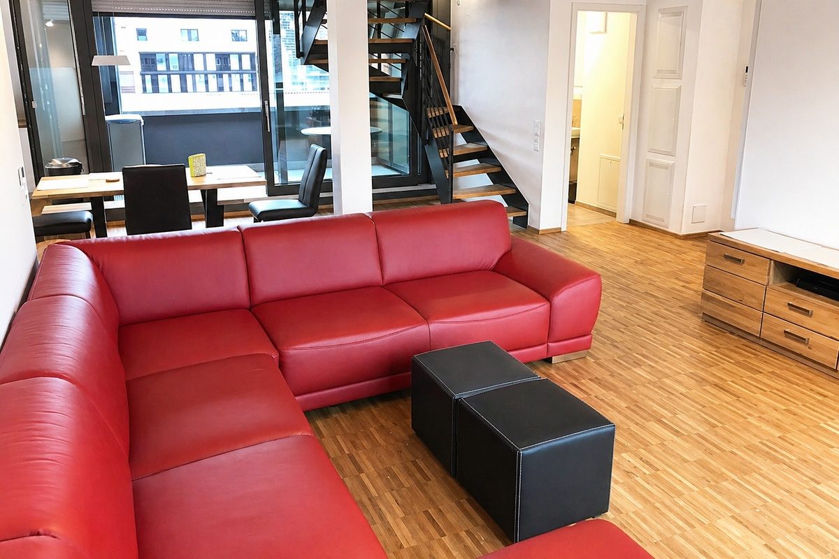 Living area with sofa in duplex apartment