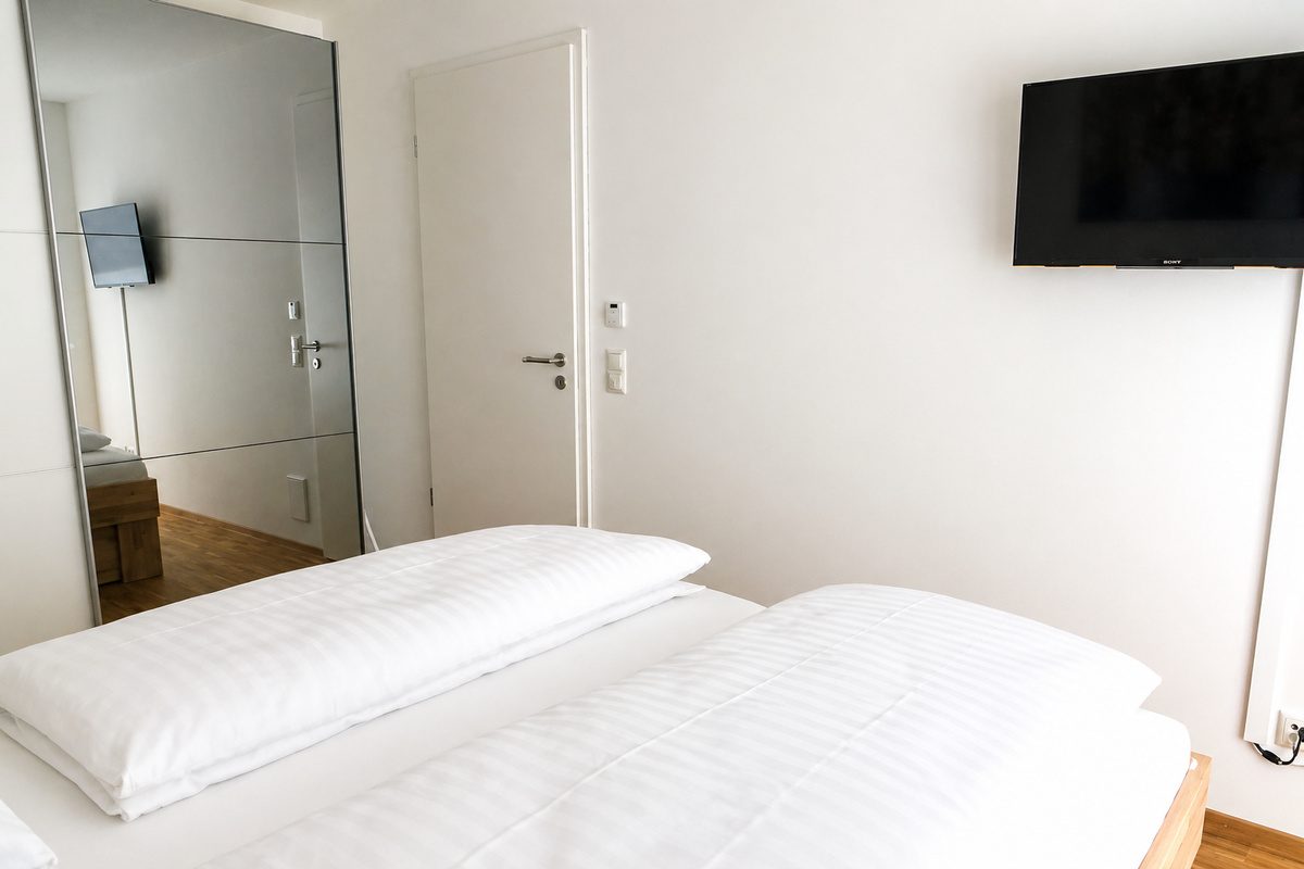 Bedroom with wardrobe and TV