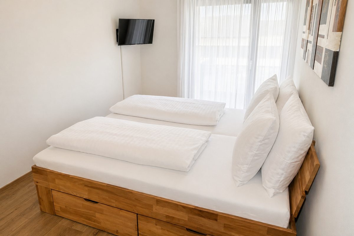 Master bedroom with king-size bed and TV