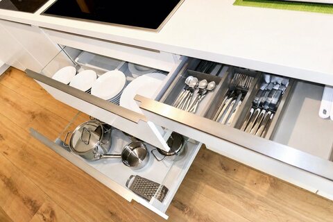 Open drawers in full kitchen