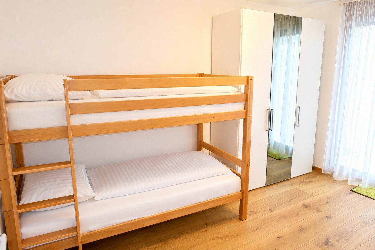 Wooden bunk bed and wardrobe in second bedroom