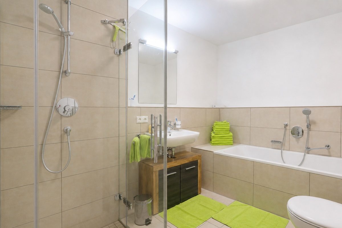 Bathroom with tub and shower