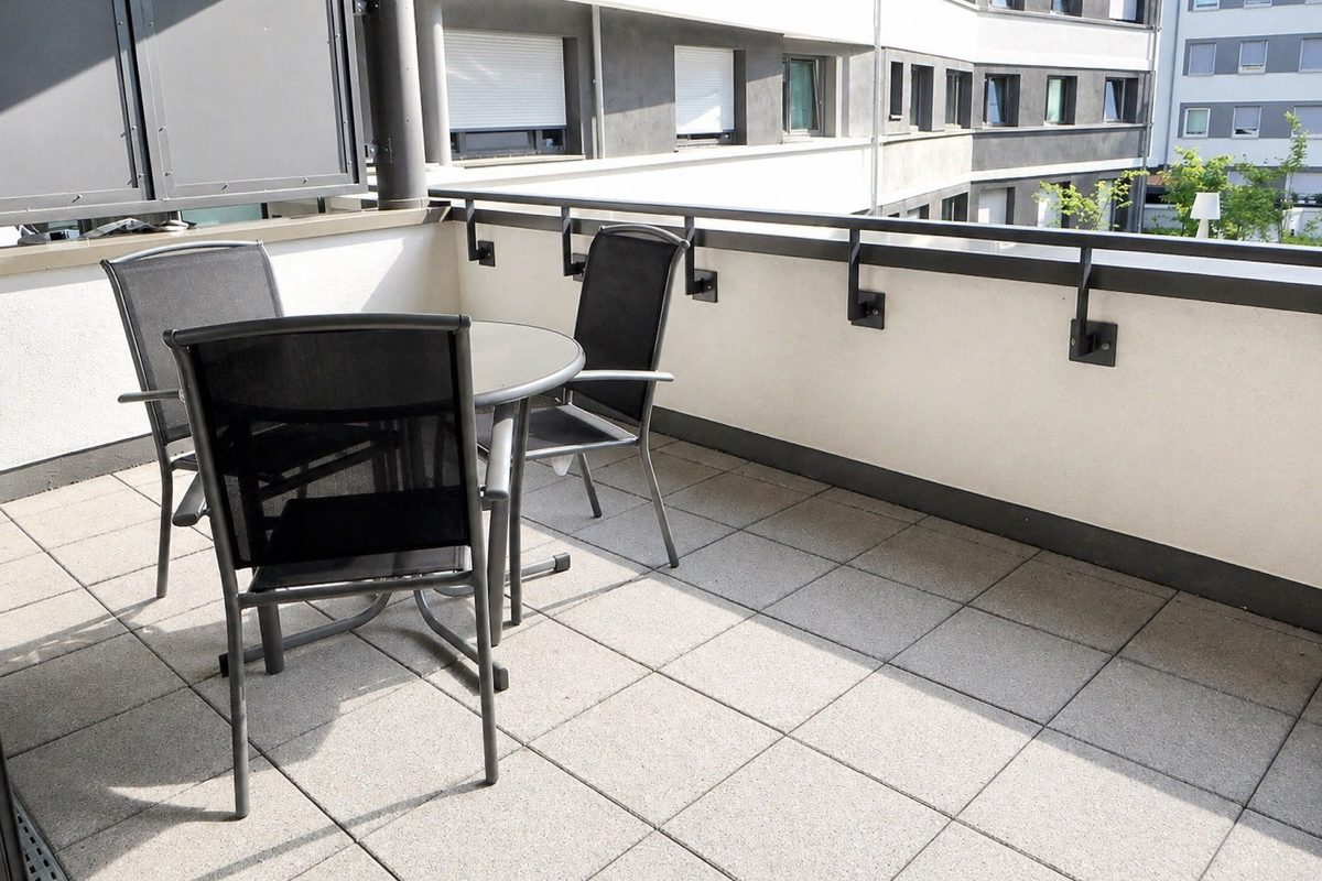 Round table and chairs on large balcony