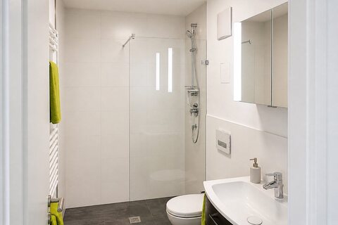 Shower, toilet and sink in bathroom
