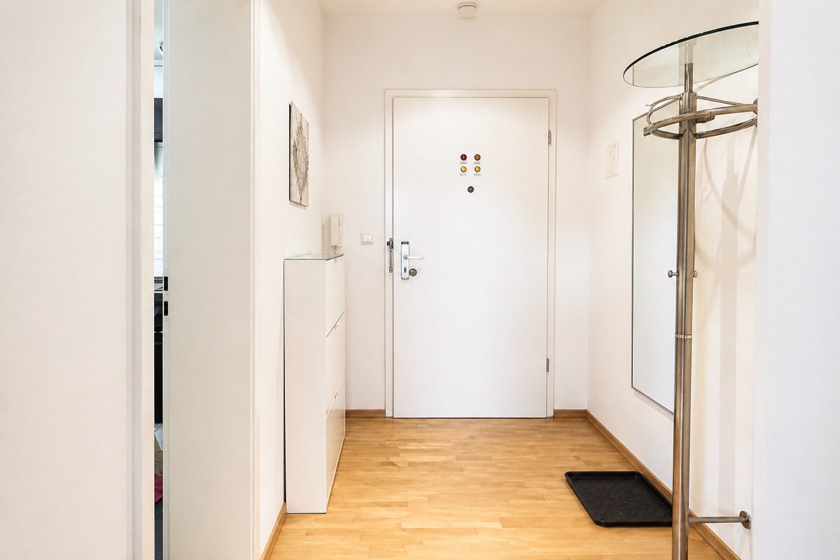 Apartment entry area with shoe cabinet and coat rack