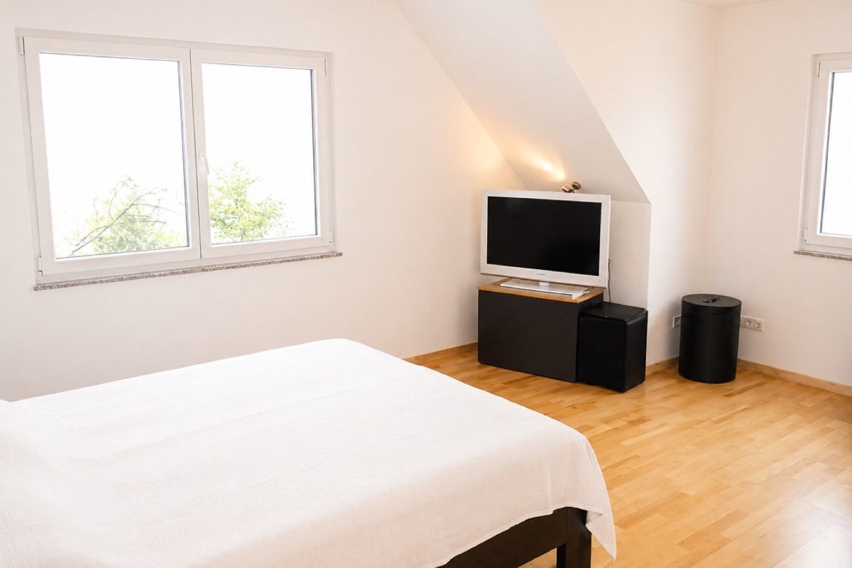 Master bedroom with king bed and TV