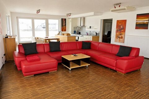 Large living and dining area in furnished apartment