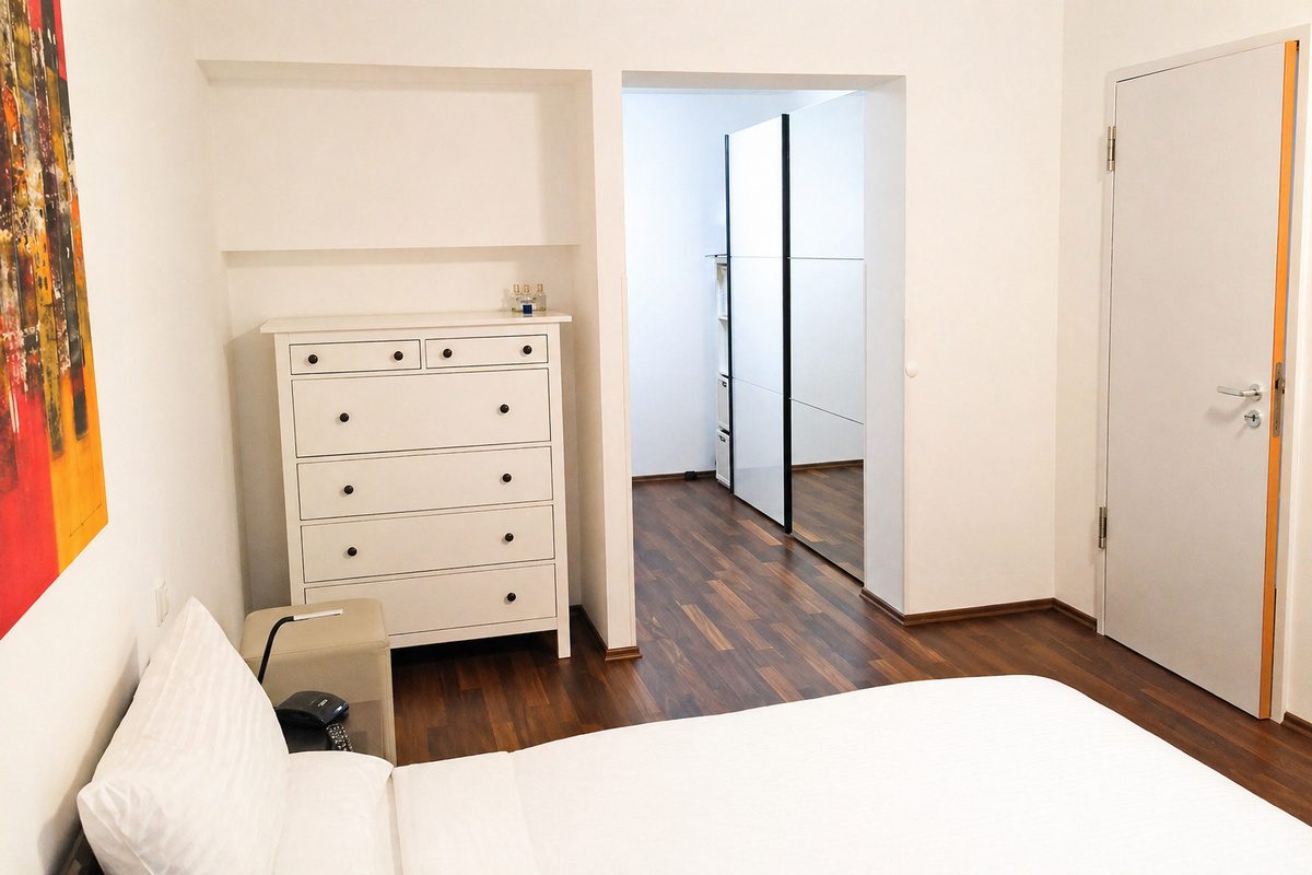 Master bedroom with dresser and wardrobe