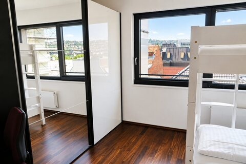 Bunk bedroom with mirror wardrobe