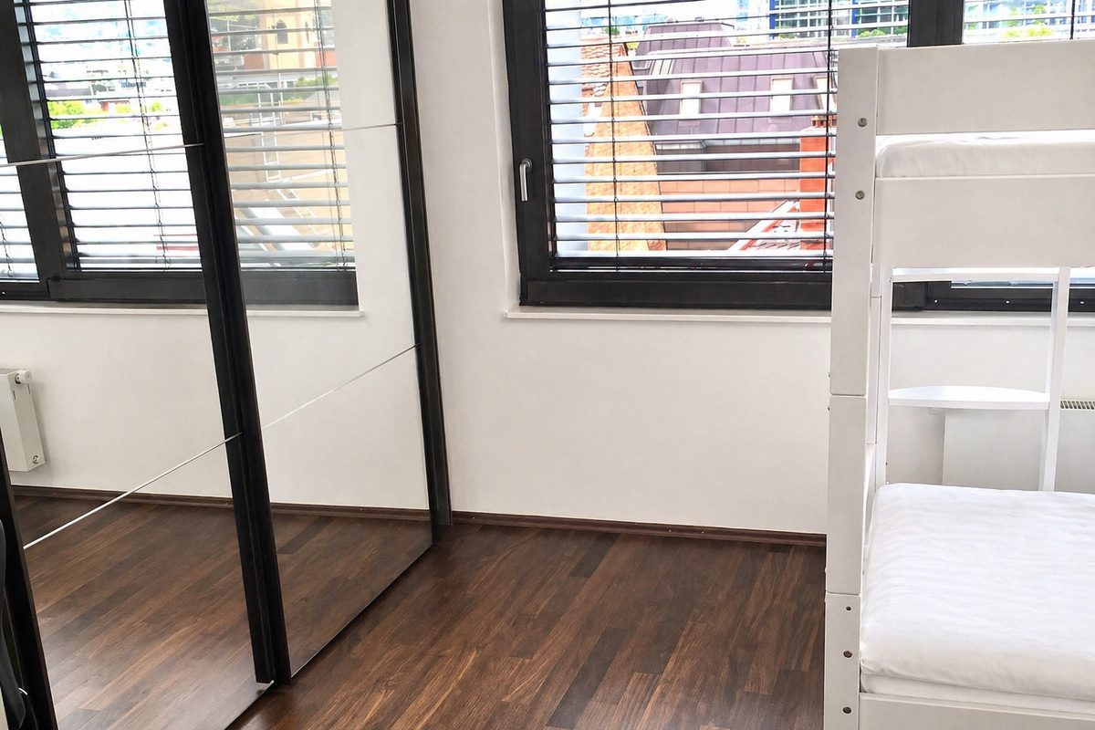 Bunk bedroom with mirror wardrobe