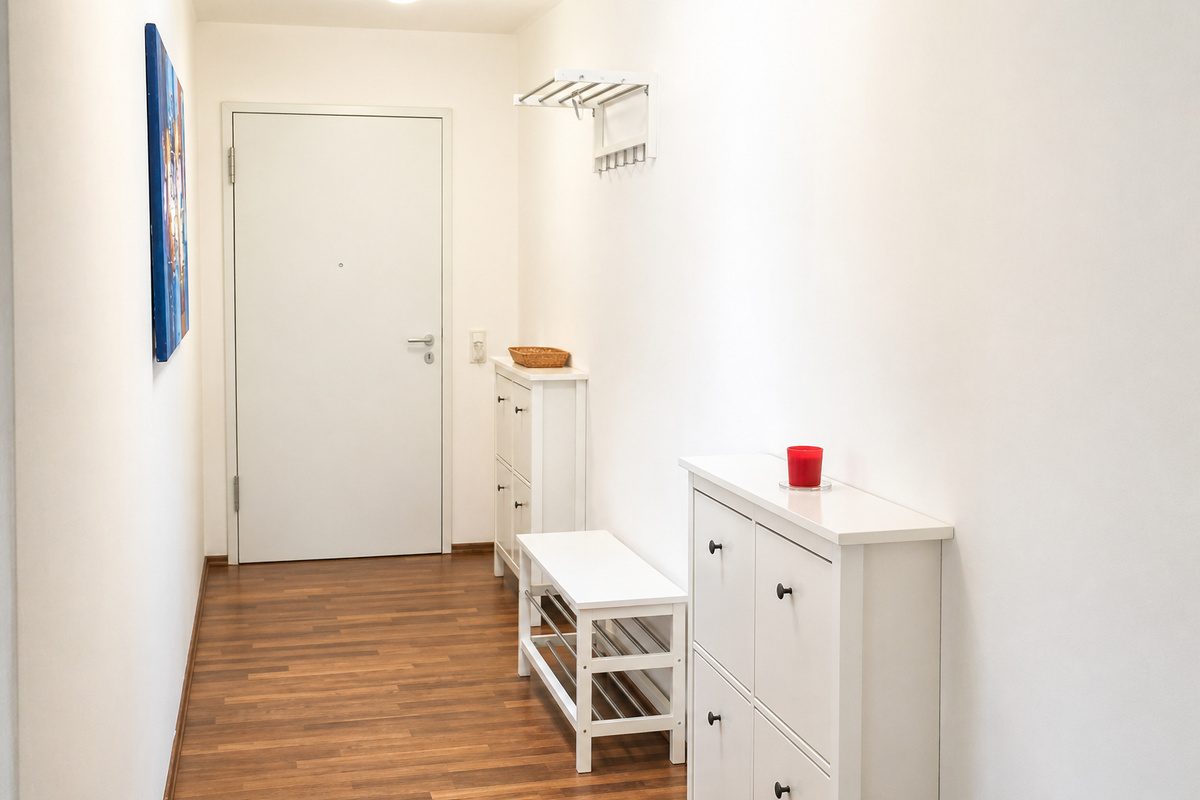 Entryway with shoe cabinets, bench and coat rack