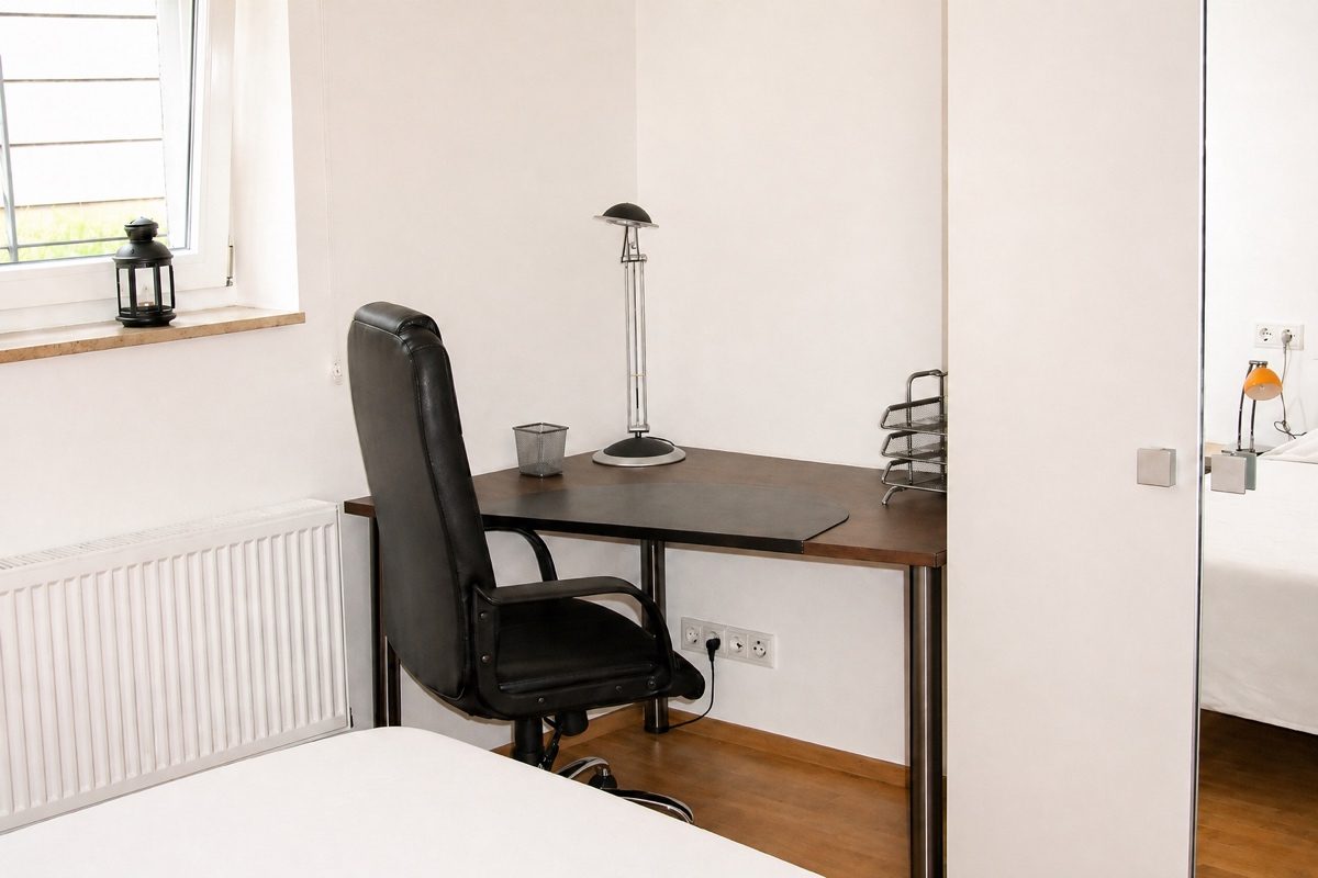 Desk and wardrobe in bedroom