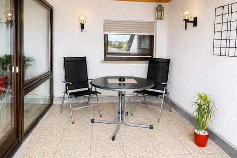 Balcony with table and chairs