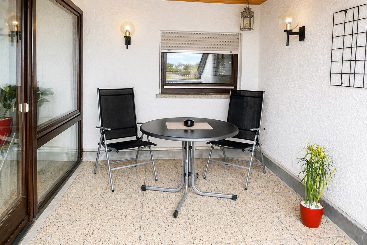 Balcony with table and chairs